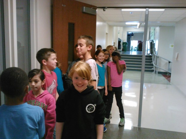 Anticipating our fabulous feast as we wait outside the cafeteria!
