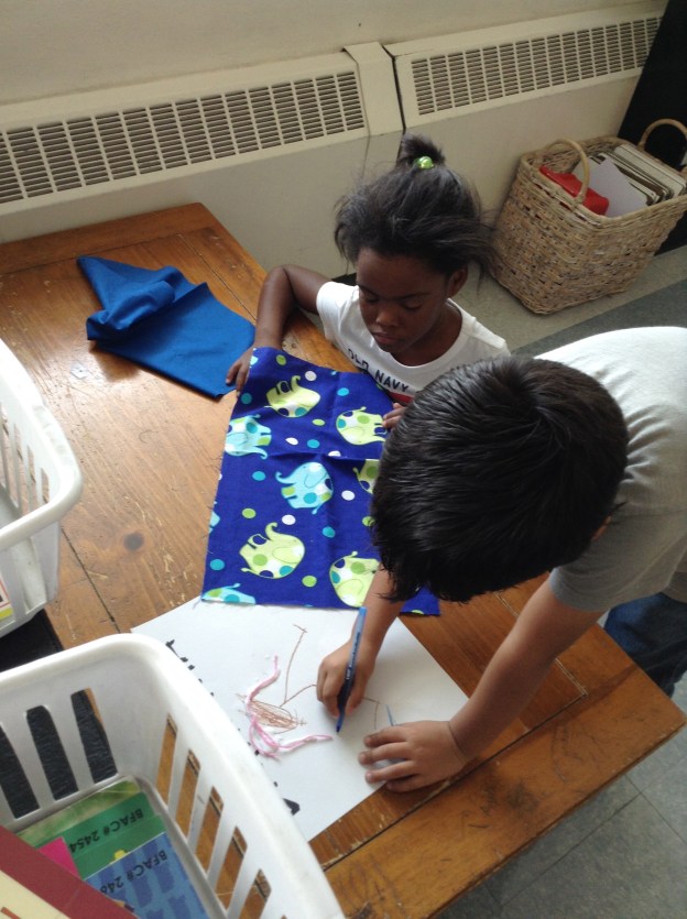 Here Diego is helping Briannia figure out how to make the cloth look like her clothes.  I love how projects like this have opportunities to work both alone and with each other.