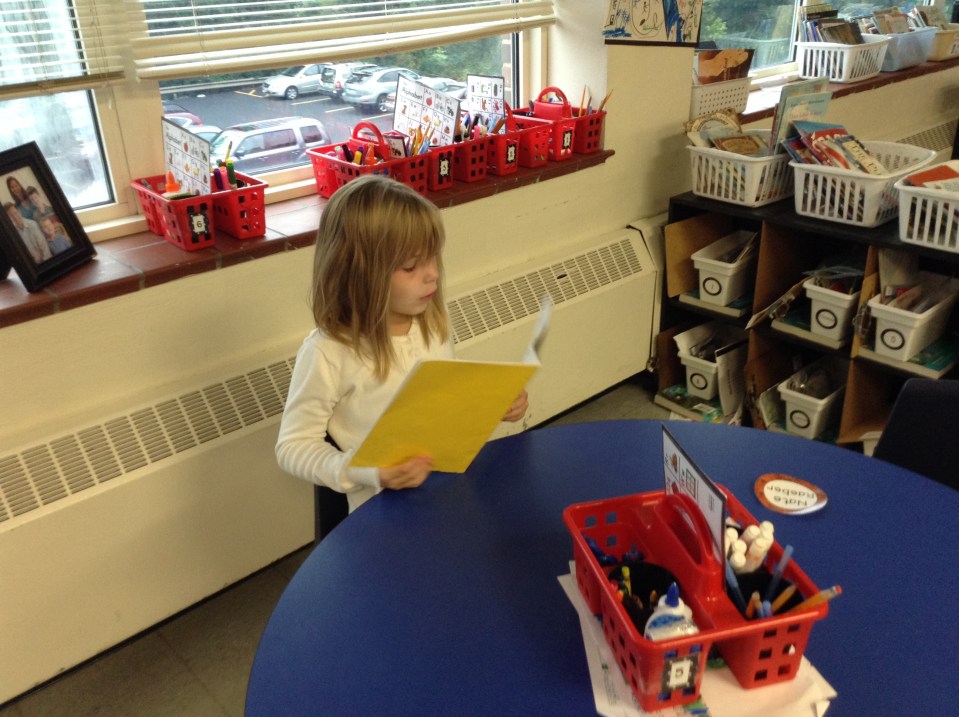 Some friends chose to read alone: Kylie is busy with a favorite story.