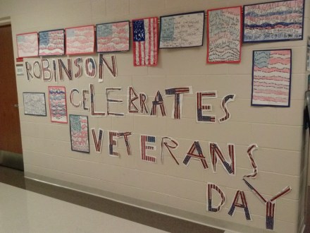 This nonfiction writing helped us celebrate Veteran's Day and was found outside the gym.